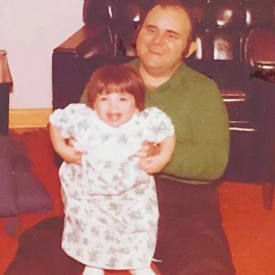Childhood picture of Cathy Areu with her father. 